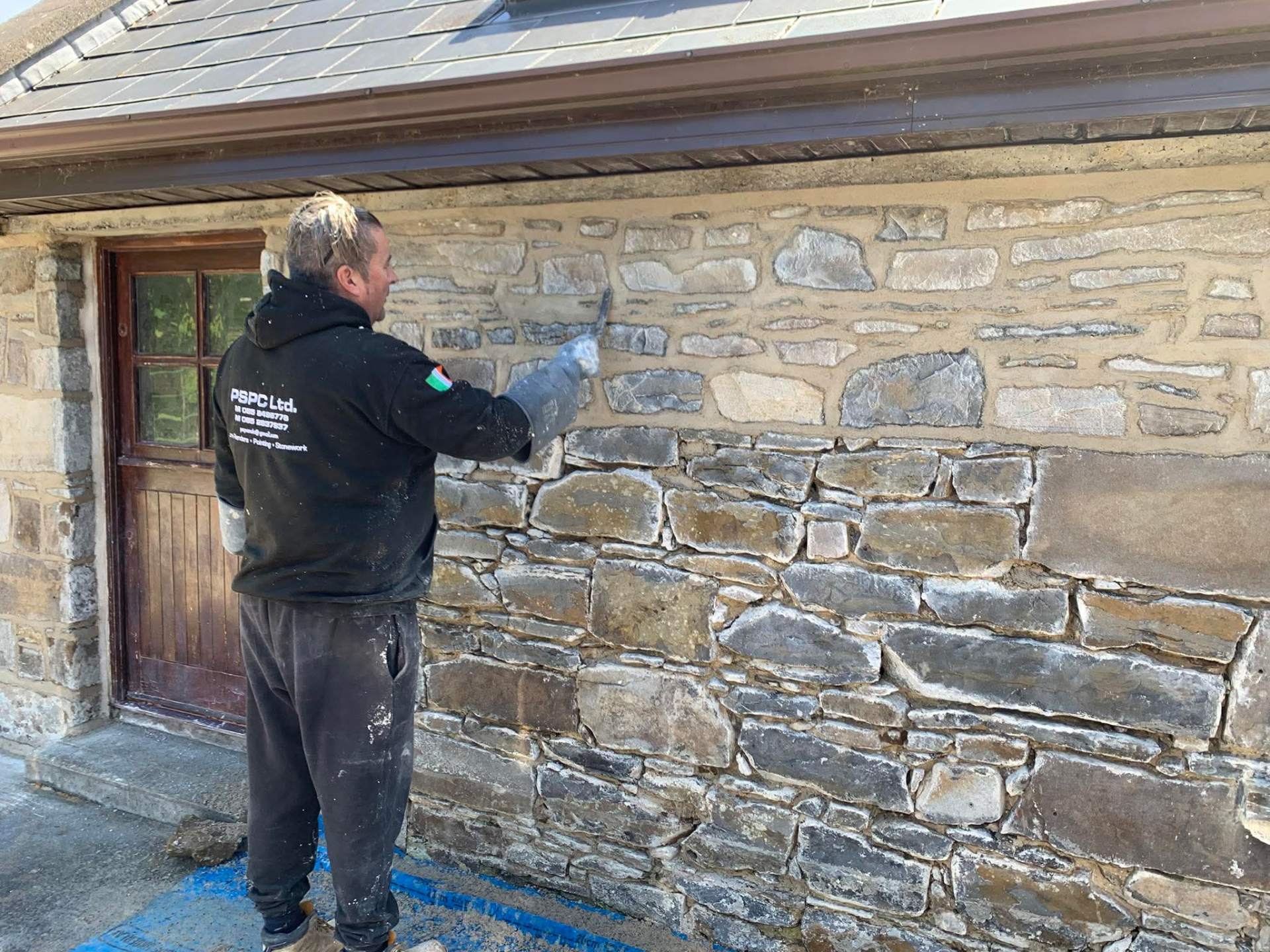 Phoenix Stone craftsman lime pointing a traditional Irish stone wall